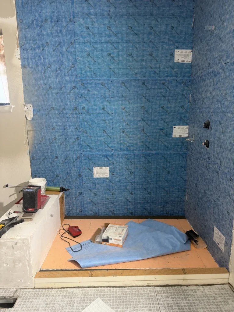 Shower waterproofing and tile substrate before bathroom finish work