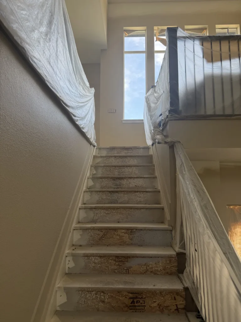 Protected stairs and railing during interior remodeling work